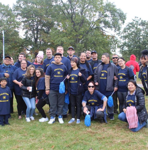 Group picture of AusomeTech Students on a sports field, in uniform.